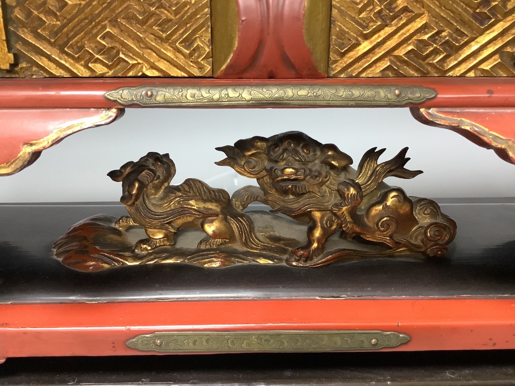 A Japanese red lacquer altar, width 63cm, height 22cm